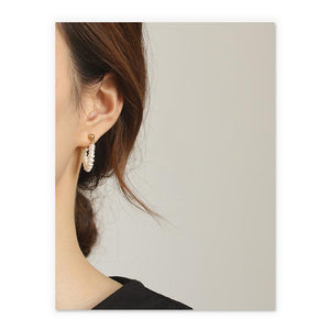 Dainty Pearl Huggies In Gold