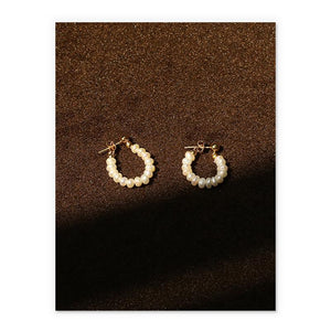 Dainty Pearl Huggies In Gold